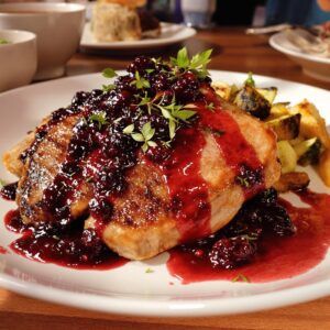 Magret de pato con salsa de frutos rojos